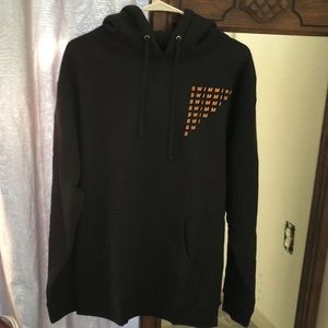 Mac Miller sweater with the word swimming on it and a wave on the back